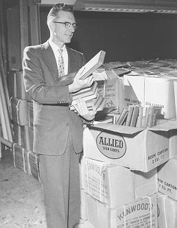 University Librarian Neal Harlow with Thomas Murray Collection, 1958